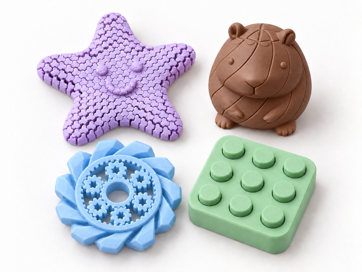 Composição ilustrativa do Kit Explorar: estrela lilás, spinner azul, bolhas verde menta e capivara marrom